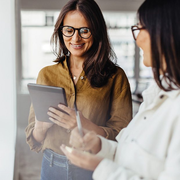 lady holding ipad smiling looking at fundraising lottery